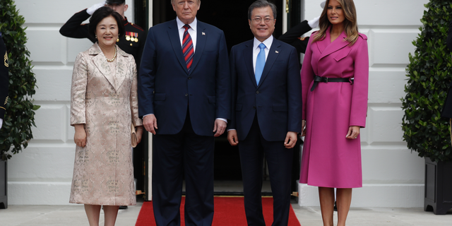 President Donald Trump and first lady Melania Trump greet South Korean President Moon Jae-In and his wife Kim Jung-Sook on the South Lawn of the White House, Thursday, April 11, 2019, in Washington. (AP Photo/Evan Vucci)