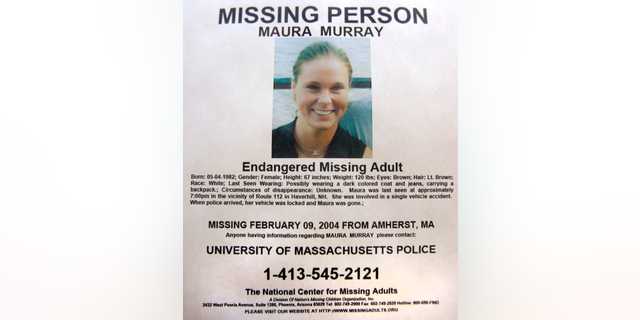 FILE - This Feb. 4, 2014 photo shows a missing person poster of Maura Murray that hangs in the lobby of the police station in Haverhill, N.H. Authorities are in an area of the northern New Hampshire town on Wednesday, April 3, 2019, related to an ongoing investigation into her disappearance in 2004. (AP Photo/Jim Cole, File)