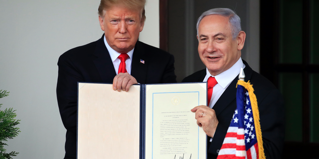 MSNBC guest: ‘It’s not hyperbole to draw comparisons’ between ‘Germany before the rise of Hitler,’ GOP today 4 FILE - In this March 25, 2019 file photo, Israeli Prime Minister Benjamin Netanyahu and President Donald Trump hold up the signed proclamation recognizing Israel's sovereignty over the Golan Heights at the White House in Washington. (AP Photo/Manuel Balce Ceneta, File)