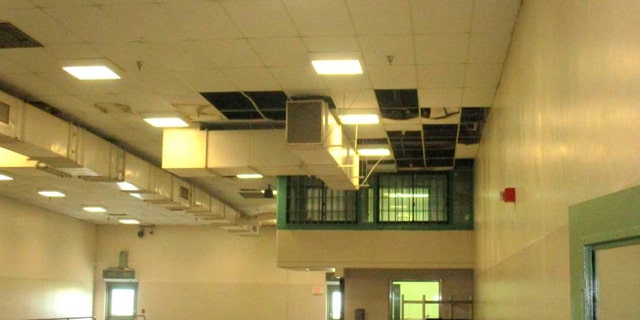 In this undated photo provided by the Prison Law Office, a non-profit public interest law firm that provides free legal services to prison inmates, is a dining hall where damaged ceiling tiles have been removed at the California Substance Abuse Treatment Facility and State Prison in Corcoran, Calif. California is spending $260 million over four years to repair leaking roofs and clear dangerous mold that imperils more than two dozen deteriorating prisons. An inmate lawsuit over the conditions says the repairs aren't moving fast enough. (Prison Law Office via AP)