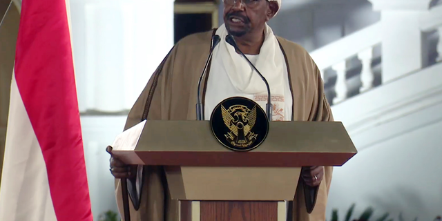 FILE -  In this file image taken from video, Sudan's President Omar al-Bashir speaks at the Presidential Palace, Friday, Feb. 22, 2019, in Khartoum, Sudan. Tens of thousands of Sudanese were making their way to the center of the country’s capital on Thursday, April 11, 2019, cheering and clapping in celebration as two senior officials said the military had forced longtime autocratic President Omar al-Bashir to step down after 30 years in power.(AP Photo/Mohamed Abuamrain, File)