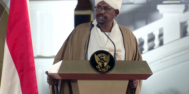 FILE - In this file image taken from video, Sudan's President Omar al-Bashir speaks at the Presidential Palace, Friday, Feb. 22, 2019, in Khartoum, Sudan. Tens of thousands of Sudanese were making their way to the center of the country’s capital on Thursday, April 11, 2019, cheering and clapping in celebration as two senior officials said the military had forced longtime autocratic President Omar al-Bashir to step down after 30 years in power.(AP Photo/Mohamed Abuamrain, File)
