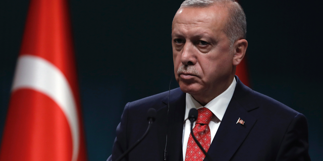Turkey's President Recep Tayyip Erdogan listens during a joint press conference with Bolivian President Evo Morales after their talks at the presidential palace in Ankara, Turkey, Tuesday, April 9, 2019. Morales is in Turkey on a two-day state visit. (AP Photo/Burhan Ozbilici)