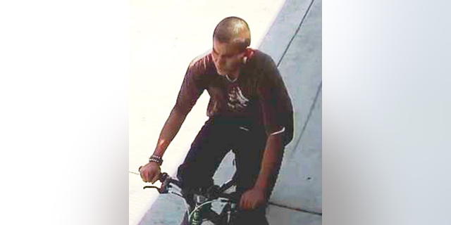 This undated photo released by the Los Angeles Police Department shows a person they are seeking in a series of slashing attacks in the city recently. Police say they are trying to find the bicyclist who rides close to people and slashes their faces and is believed to have struck six times since March 2019. Police in a statement said that a man standing near a bus stop was attacked on Monday, April 1, 2019, and a woman was slashed about a mile away. They were hospitalized with severe injuries and are expected to survive. (Los Angeles Police Department via AP)