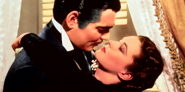 This image released by Turner Classic Movies shows Clark Gable, left, and Vivien Leigh in a scene from "Gone with the Wind." On Thursday, the TCM Classic Film Festival will open its 10th annual edition in Los Angeles with "When Harry Met Sally..." To mark its anniversary, TCM will on Sunday again air "Gone With the Wind," the film that it first transmitted on April 14, 1994. (Turner Classic Movies via AP)