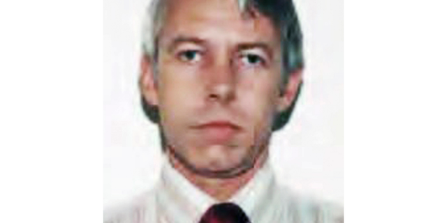 FILE – This undated file photo shows a photo of Dr. Richard Strauss, an Ohio State University team doctor employed by the school from 1978 until his 1998 retirement. A year after Ohio State announced an investigation into allegations of decades-old sexual misconduct by Strauss, a team doctor, his accusers are still waiting for the findings. Strauss killed himself in 2005. (Ohio State University via AP, File)