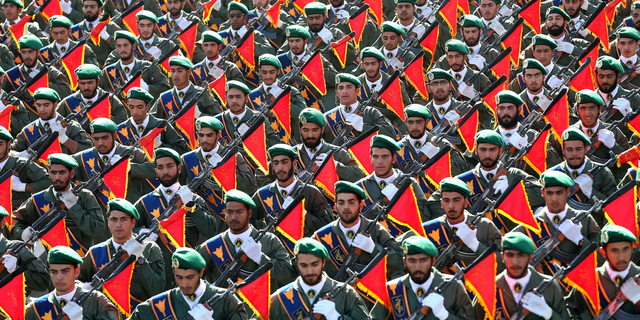 FILE - In this Sept. 21, 2016 file photo, Iran's Revolutionary Guard troops march in a military parade marking the 36th anniversary of Iraq's 1980 invasion of Iran, in front of the shrine of late revolutionary founder Ayatollah Khomeini, just outside Tehran, Iran. (AP Photo/Ebrahim Noroozi, File)