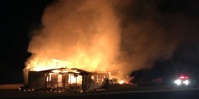 This Friday, March 29, 2019, photo provided by the New Market Fire and Rescue Team shows a fire at the main offices of the Highlander Education and Research Center in New Market, Tenn. The center is a social justice center that trained the Rev. Martin Luther King Jr. and other civil rights leaders. Representatives of the center said Tuesday, April 2, 2019, that a white power symbol was also found spray painted on the parking lot near the building. (Sammy Solomon/New Market Fire and Rescue Team via AP)