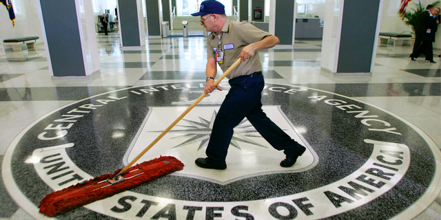FILE - In this March 3, 2005, file photo, a workman dusts the floor at the Central Intelligence Agency headquarters in Langley, Va. The American Civil Liberties Union has filed a lawsuit challenging a pre-publication review required for people who have had access to government secrets. The CIA says the pre-publication review is necessary to protect national security and protect former employees from legal liability. Timothy Barrett, a CIA spokesman, said the agency “does not comment on pending litigation." (AP Photo/J. Scott Applewhite, File)