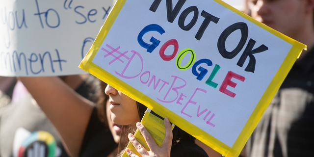 In this Nov. 1, 2018, file photo, workers protest against Google's handling of sexual misconduct allegations at the company's Mountain View, Calif., headquarters. (AP Photo/Noah Berger)