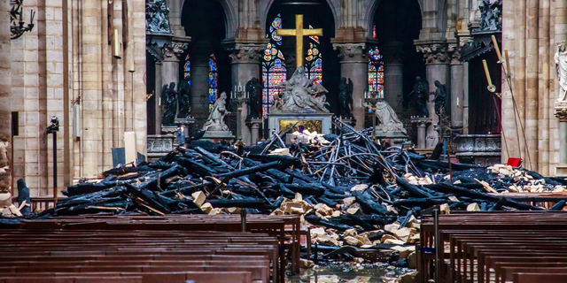 A hole is seen in the dome inside Notre Dame cathedral in Paris, Tuesday, April 16, 2019.