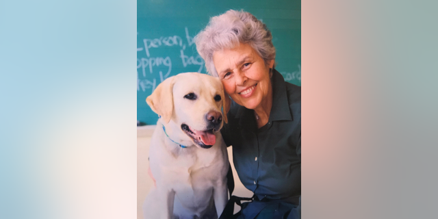 Judith Clark with one of the service dogs she has trained at the Bedford Hills Correctional Facility in Bedford, N.Y.