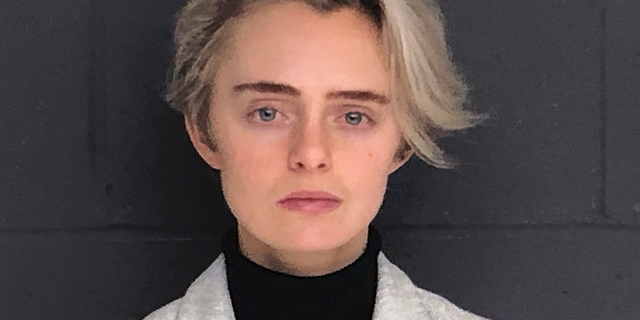 FILE - This Monday, Feb. 11, 2019, booking photo released by the Bristol County Sheriff's Office shows Michelle Carter, ordered to start serving a 15-month jail sentence for her involuntary manslaughter conviction for sending a barrage of text messages urging boyfriend Conrad Roy III to kill himself. Roy took his own life in Fairhaven, Mass., in July 2014. An attorney for Lynn Roy, the boy's mother, said Tuesday, April 9, that her wrongful death suit against Carter had been "resolved." (Bristol County Sheriff's Office via AP, File)