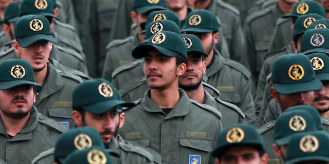 FILE - In this Feb. 11, 2019 file photo, Iranian Revolutionary Guard members attend a ceremony celebrating the 40th anniversary of the Islamic Revolution, at the Azadi, or Freedom, Square in Tehran, Iran. The Trump administration on Wednesday granted important exemptions to new sanctions on Iran’s Revolutionary Guard, watering down the effects of the measures while also eliminating an aspect that would have complicated U.S. foreign policy efforts. (AP Photo/Vahid Salemi)