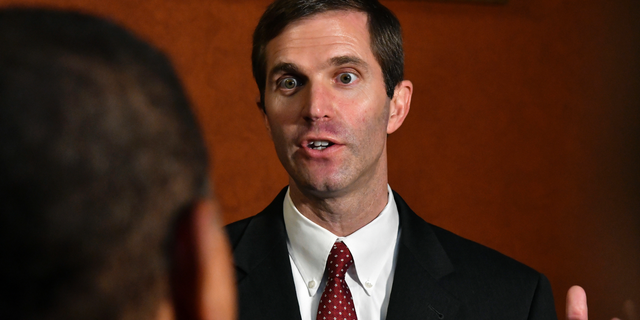 FILE - In a Thursday, Sept. 20, 2018 file photo, Kentucky Attorney General Andy Beshear answers a reporters' question following his presentation to the Supreme Court at the Kentucky Capitol in Frankfort, Ky. says it disagrees with Kentucky’s Democratic attorney general over the validity of a state law that could determine if the state’s only abortion clinic stays open. The disagreement stems from a legal brief filed by Attorney General Beshear in support of the clinic, EMW Women’s Surgical Center in Louisville. (AP Photo/Timothy D. Easley, File)
