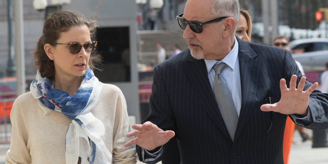 Clare Bronfman, left, arrives at Federal court with her attorney Mark Geragos in the Brooklyn borough of New York, Friday, April 19, 2019. Bronfman has pleaded guilty to charges implicating her in a sex-trafficking conspiracy case against an upstate New York self-help group. (AP Photo/Mary Altaffer)