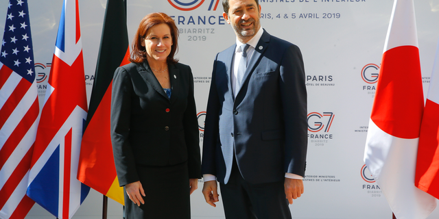 U.S. Homeland Security official Claire Grady, left, is welcomed by French Interior Minister Christophe Castaner for a G7 meeting at ministerial level in Paris, Thursday April 4, 2019. Foreign and interior ministers from the Group of Seven are gathering in France this week to try to find ambitious solutions to world security challenges. Putting a dampener on that are two glaring American absences: U.S. Secretary of State Mike Pompeo and Homeland Security Secretary Kirstjen Nielsen. (AP Photo/Michel Euler)