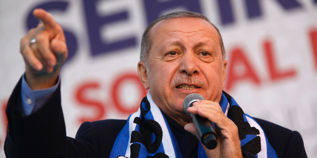 FILE-In this Tuesday, March 5, 2019 file photo Turkey's President Recep Tayyip Erdogan gestures as he delivers a speech at a rally of his ruling Justice and Development Party's (AKP) in Istanbul. The mood among opposition supporters in Turkey's biggest city is one of jubilation but also worry - fear that their win in Istanbul's mayoral race could be overturned in a recount taking place after the ruling party challenged the election results. (AP Photo/Lefteris Pitarakis, File)