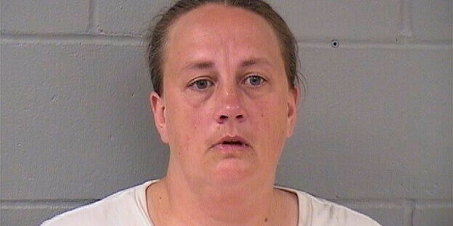 his booking photo taken Sept. 12, 2018 from the Hardin County Sheriff’s Office shows Traci Tyler. Tyler is charged with kidnapping for confining her boyfriend's 8-year-old son under basement stairs has been convicted of a lesser charge. A judge on Wednesday, April 10, 2019 found Tyler guilty of misdemeanor false imprisonment. Prosecutors say she and the boy's father, Alex Shadlow, locked the boy in the basement of their Ackley home for at least nine hours a day in summer 2017. (Hardin County Sheriff’s Office via AP)