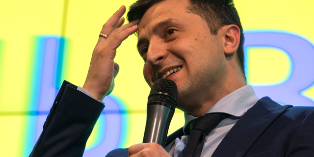 Ukrainian comedian Volodymyr Zelenskiy, reacts as he responds to a journalist question during a press conference, after the presidential elections in Kiev, Ukraine, Sunday, March. 31, 2019. (AP Photo/Emilio Morenatti)