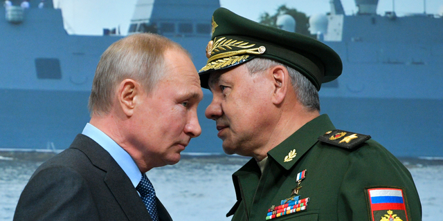 Russian President Vladimir Putin, left, and Russian Defense Minister Sergei Shoigu during a visit to a shipyard in Saint Petersburg, Russia, Tuesday, April 23, 2019.