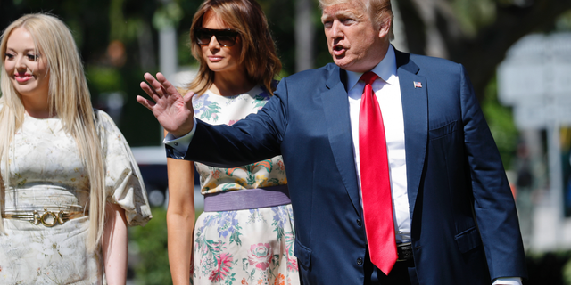 President Donald Trump, right, with first lady Melania Trump, center, and daughter Tiffany Trump, left, arrive for Easter services at Episcopal Church of Bethesda-by-the-Sea, Sunday, April 21, 2019, in Palm Beach, Fla. (AP Photo/Pablo Martinez Monsivais)