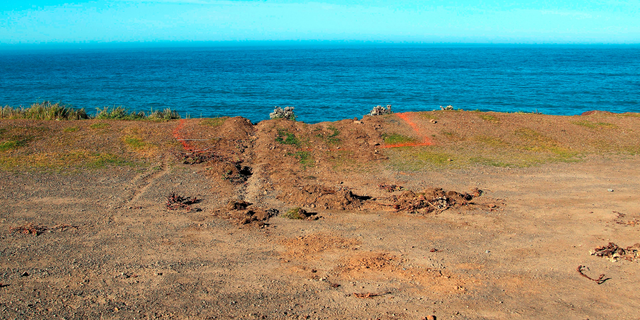 FILE - This March 29, 2018, file photo shows ruts cut into the clifftop where the SUV of Jennifer and Sarah Hart that went off the cliff was hauled up and over by a tow truck off the Pacific Coast Highway near Westport, Calif. A California Highway Patrol investigator testified Thursday, April 4, 2019 that Sarah Hart searched whether death by drowning was relatively painless hours before her wife drove an SUV off a cliff, killing them and six adopted children in waters below. A special coroner's jury in Mendocino County is trying to determine whether the March 2018 deaths were murder-suicide or accidental. (Kale Williams/The Oregonian via AP, File)