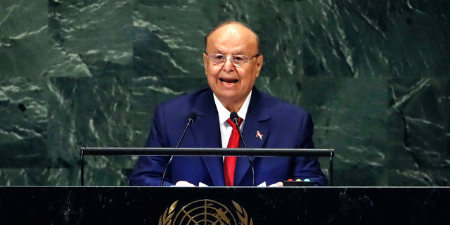FILE - In this Sept. 26, 2018 file photo, Yemen's President Abed Rabbo Mansour Hadi addresses the 73rd session of the United Nations General Assembly, at U.N. headquarters. Yemeni officials say heavy fighting in Yemen’s southern Dhale province between pro-government forces and Shiite rebels has killed more than 85 people. The officials say the Houthi rebels recaptured the district of Damt and the surrounding area from forces allied with the internationally recognized government after more than a week of fighting. They say dozens have been wounded. Yemen has been embroiled in a civil war pitting the Iran-backed Houthis against the government of President Abed Rabbo Mansour Hadi, backed by a Saudi-led coalition since March 2015. (AP Photo/Richard Drew, File)