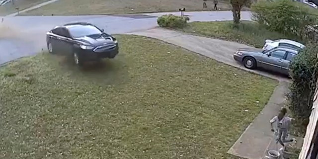 In this video frame grab made available by attorney Chris Stewart, shows a speeding car out of control before it hits LaDerihanna Holmes, 9, as she plays in her front yard Friday, March 29, 2019 in Lithonia, Ga. The driver is still at large. (Chris Stewart via AP)