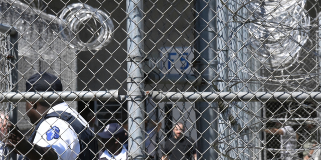 Prison staff work at Lee Correctional Institution on Wednesday, April 10, 2019, in Bishopville, S.C. A year after seven South Carolina prison inmates died in an insurrection, corrections officials say they've made improvements to the facility that for a night was the scene of some of the agency's worst violence. (AP Photo/Meg Kinnard)