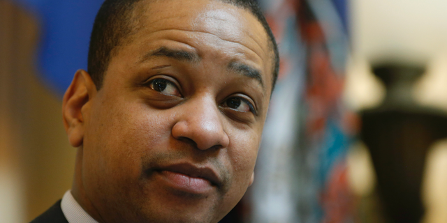 FILE - In this Feb. 22, 2019 file photo, Virginia Lt. Gov. Justin Fairfax presides over the Senate session at the Capitol in Richmond, Va. One of the two women accusing Fairfax of sexual assault says his response has been "disgraceful, irresponsible and manipulative." In an interview aired Monday, April 1 with CBS News, Vanessa Tyson criticized Fairfax for comparing himself to lynching victims when he defended himself in a speech on the state Senate floor in February. (AP Photo/Steve Helber, File)