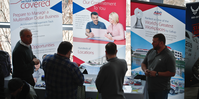 FILE- In this March 7, 2019, file photo visitors to the Pittsburgh veterans job fair meet with recruiters at Heinz Field in Pittsburgh. On Wednesday, April 3, payroll processor ADP reports how many jobs private employers added in March. (AP Photo/Keith Srakocic, File)