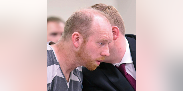 Chad Isaak listens to counsel in district court while being charged with four counts of class AA felony murder in district court on Friday, April 5, 2019, in Mandan, N.D. Isaak was arrested in Washburn on Thursday and charged with murdering four people in Mandan on Monday. He is being held on one million dollars bail. (Tom Stromme/The Bismarck Tribune via AP)