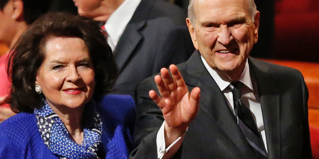 FILE - In this Oct. 6, 2018, file photo, President Russell M. Nelson and his wife, Wendy, wave as they leave the morning session of a twice-annual conference of The Church of Jesus Christ of Latter-day Saints in Salt Lake City. Nelson has generated buzz in his first year by becoming one of the most visible presidents in modern church history and implementing a number of changes. (AP Photo/Rick Bowmer, File)
