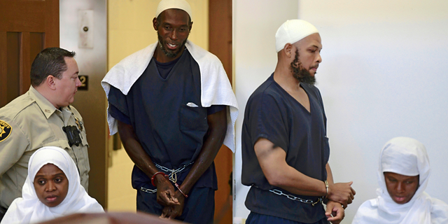 FILE - This Aug. 13, 2018 pool file photo shows defendants, from left, Jany Leveille, Lucas Morton, Siraj Ibn Wahhaj and Subbannah Wahhaj entering district court in Taos, N.M. U.S. prosecutors will not seek the death penalty against the four adults who lived at a New Mexico compound where authorities found the remains of a toddler who was reported missing in Georgia, court documents say. (Roberto E. Rosales/The Albuquerque Journal via AP, Pool, File)