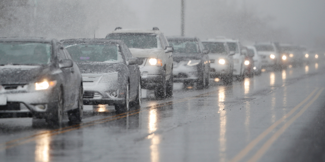 Traffic backs up along 56th Avenue as a spring storm rolls in before the evening rush hour Wednesday, April 10, 2019, in Denver. Blizzard warnings have been issued for the northern half of Colorado's heavily populated Front Range region, including Denver, as well as the state's northeastern plains through midday Thursday. (AP Photo/David Zalubowski)