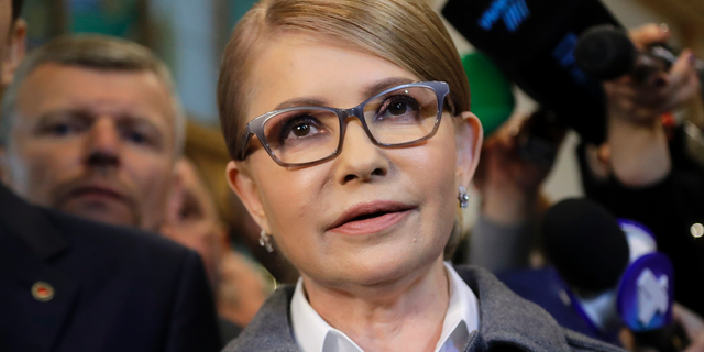 Former Ukrainian Prime Minister Yulia Tymoshenko, a candidate for the presidential elections, talks to the media after casting her ballot at a polling station during the presidential election in Kiev, Ukraine, Sunday, March 31, 2019. (AP Photo/Sergei Grits)