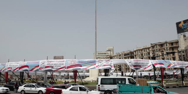 Banners supporting proposed amendments to the Egyptian constitution hang in Tahrir Square, Cairo, Egypt, Tuesday, April 9, 2019. The referendum by voters to approve the amendments is to be held on April 14. (AP Photo/Nariman El-Mofty)