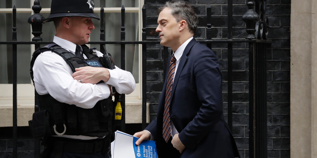 Britain's Chief Whip Julian Smith leaves 10 Downing Street, London, Thursday, March 28, 2019. The British government says it plans to hold a new Brexit debate in Parliament Friday, but hasn't confirmed whether it will call a third vote on its twice-rejected European Union divorce deal. (AP Photo/Matt Dunham)