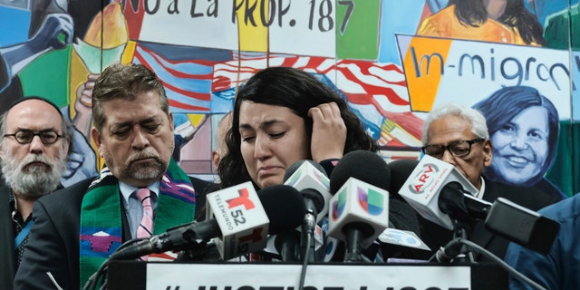 Melissa Castro tries to force back tears as she talks about her husband, Jose Luis Ibarra Bucio, while joined by local religious leaders during a news conference at the offices of the Coalition for Humane Immigrant Rights of Los Angeles (CHIRLA), Wednesday, April 10, 2019, in Los Angeles. The family of the 27-year-old man who died after a short stint in a California immigration detention facility demanded answers Wednesday about what happened to him and the timing of his release. Melissa Castro said her husband, was released as his health deteriorated from a brain hemorrhage and while he was in a coma from which he never awoke. (AP Photo/Richard Vog)el