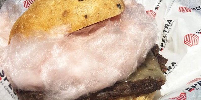The burger includes a green chili bun, grilled Angus burger, ghost pepper cheese and a large puff of red chili cotton candy.