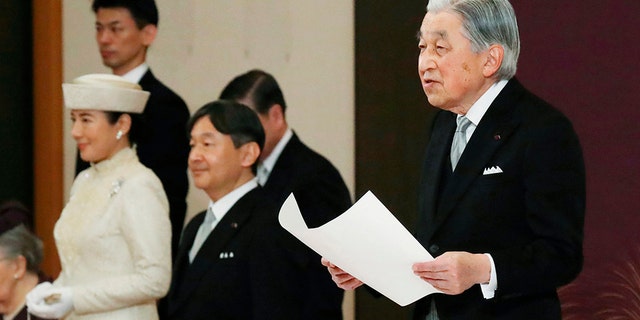 Japan's Emperor Akihito speaks during the ceremony of his abdication in front of other members of the royal families and top government officials at the Imperial Palace in Tokyo, Tuesday. The 85-year-old Akihito ends his three-decade reign on Tuesday as his son Crown Prince Naruhito, second from left, will ascend the Chrysanthemum throne on Wednesday.