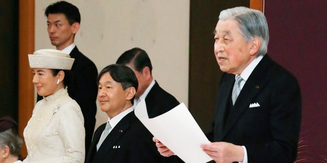 Japan's Crown Prince Naruhito, second from left, and Crown Princess Masako, left, listen to Emperor Akihito speak during the ceremony of Akihito's abdication at the Imperial Palace in Tokyo April 30, 2019. 