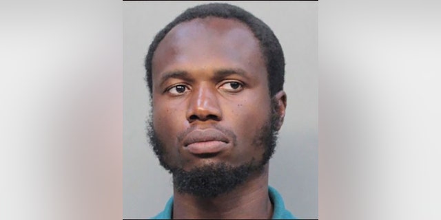 Holdson Marcelin, 38, allegedly smeared blood on an American flag at a Florida village hall.
