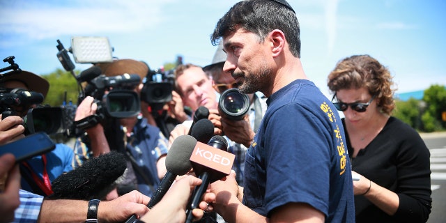 Oscar Stewart, who chased off the gunman inside the synagogue, speaks with members of the media in front of the Chabad of Poway Synagogue on Sunday, April 28, 2019 in Poway, California.