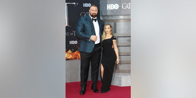 Hafthor Julius Bjornsson and Kelsey Henson attend the premiere of "Game of Thrones" at Radio City Music Hall on April 3, 2019 in New York City.