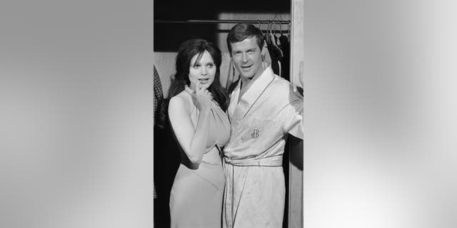 Roger Moore and Madeline Smith. Photo by Terry O'Neill/Iconic Images/Getty Images