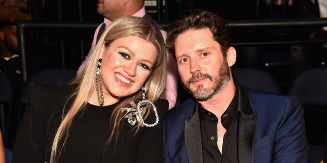 Kelly Clarkson and Brandon Blackstock at an awards show.