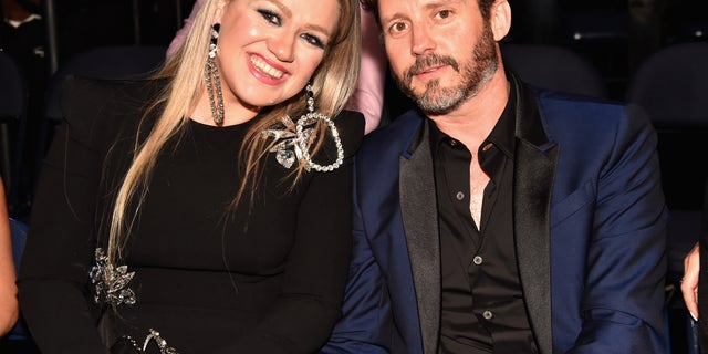 Kelly Clarkson and Brandon Blackstock appeared on stage together at the final performance of her tour.