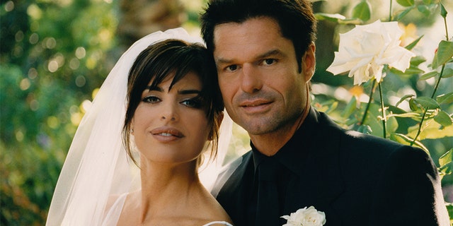 Lisa Rinna and Harry Hamlin pose for a photo after their wedding at their home on March 29, 1997 in Beverly Hills, California. — Photo by Roxanne McCann/Getty Images
